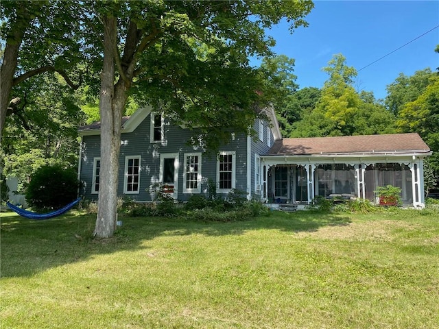 25 N Academy St, Middlebury, NY 14591 - back of property with a sunroom and a lawn