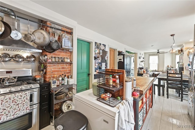 228 Potomac Ave, Buffalo, NY 14213 - kitchen with stainless steel gas stove and light countertops