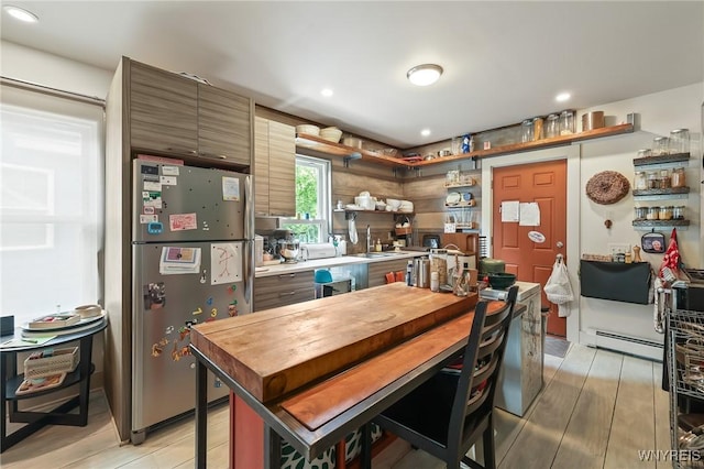 228 Potomac Ave, Buffalo, NY 14213 - kitchen featuring freestanding refrigerator, baseboard heating, light wood-style floors, open shelves, and recessed lighting