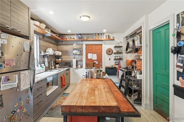 228 Potomac Ave, Buffalo, NY 14213 - kitchen with appliances with stainless steel finishes, butcher block counters, light wood finished floors, open shelves, and recessed lighting