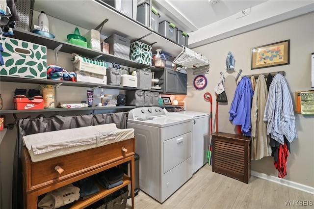 228 Potomac Ave, Buffalo, NY 14213 - laundry room with washing machine and dryer and light wood finished floors