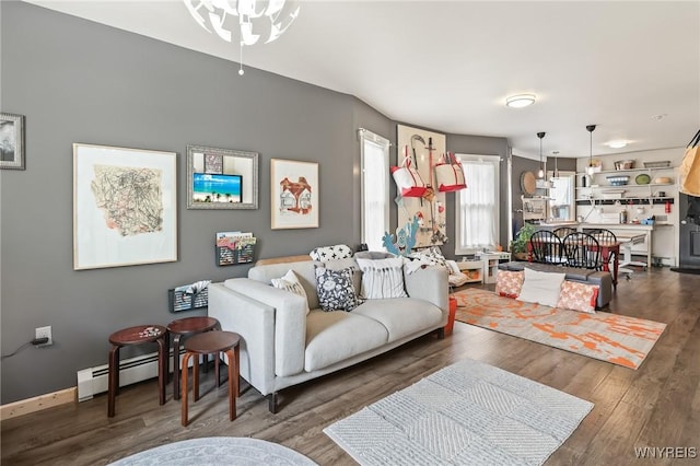 228 Potomac Ave, Buffalo, NY 14213 - living room featuring a baseboard radiator, wood finished floors, and ceiling fan