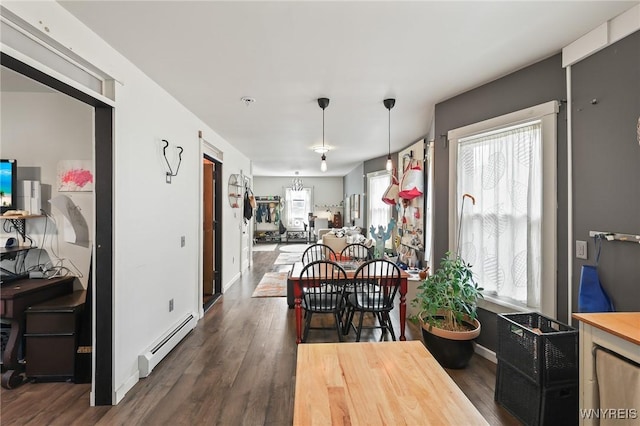 228 Potomac Ave, Buffalo, NY 14213 - dining area featuring baseboard heating and dark wood-type flooring