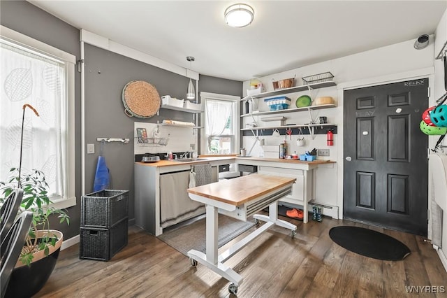 228 Potomac Ave, Buffalo, NY 14213 - kitchen with open shelves, butcher block countertops, wood finished floors, and white cabinetry