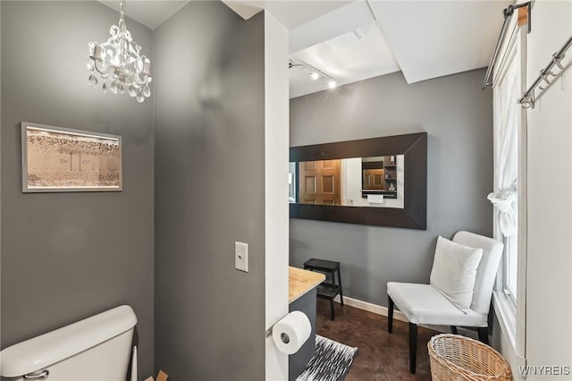 228 Potomac Ave, Buffalo, NY 14213 - bathroom featuring finished concrete flooring, track lighting, and a chandelier