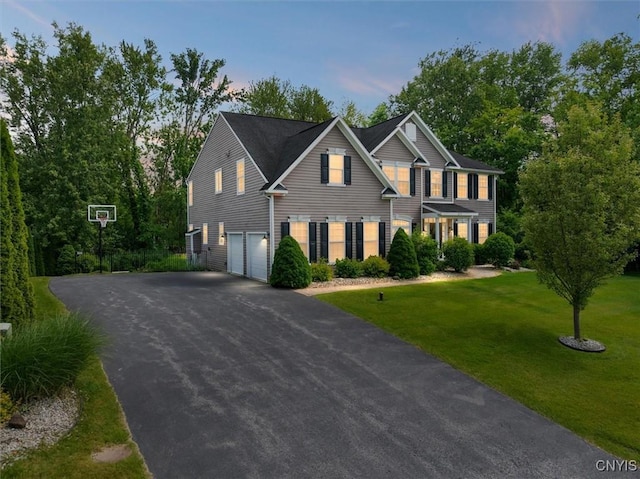 8278 Luchsinger Ln, Lysander, NY 13027 - view of front facade with an attached garage, driveway, and a front yard