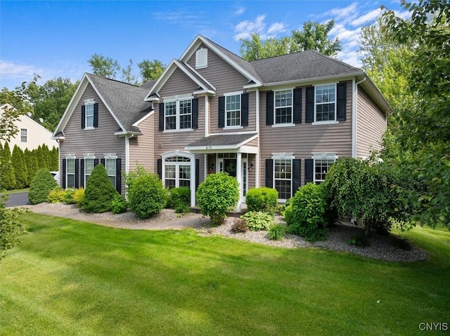 8278 Luchsinger Ln, Lysander, NY 13027 - view of front of property featuring a front lawn and a shingled roof