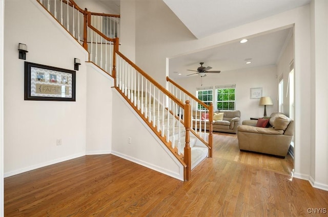8278 Luchsinger Ln, Lysander, NY 13027 - staircase with wood finished floors, ceiling fan, and recessed lighting