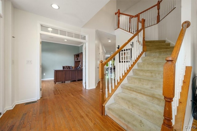8278 Luchsinger Ln, Lysander, NY 13027 - stairway with wood finished floors and recessed lighting