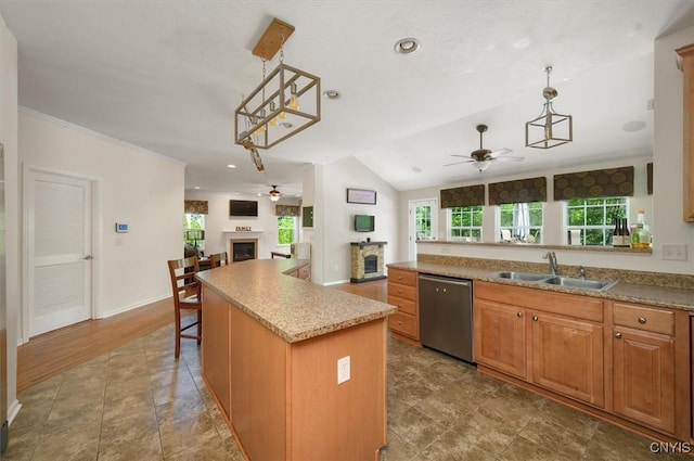 8278 Luchsinger Ln, Lysander, NY 13027 - kitchen featuring ceiling fan, stainless steel dishwasher, a fireplace, open floor plan, and vaulted ceiling