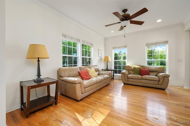 8278 Luchsinger Ln, Lysander, NY 13027 - living area featuring light wood finished floors, ornamental molding, ceiling fan, and recessed lighting