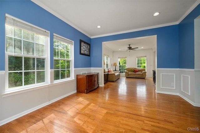 8278 Luchsinger Ln, Lysander, NY 13027 - empty room with light wood-style flooring, wainscoting, recessed lighting, a ceiling fan, and ornamental molding