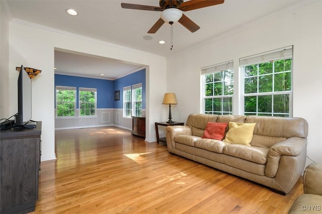 8278 Luchsinger Ln, Lysander, NY 13027 - living room featuring ornamental molding, light wood finished floors, a ceiling fan, a wainscoted wall, and recessed lighting