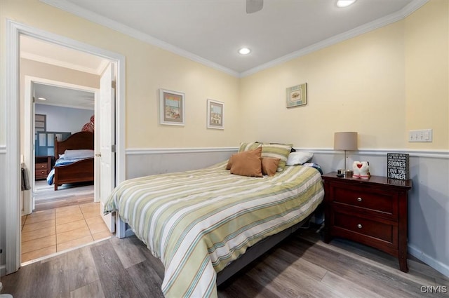 8278 Luchsinger Ln, Lysander, NY 13027 - bedroom with wood finished floors, ornamental molding, recessed lighting, and a wainscoted wall
