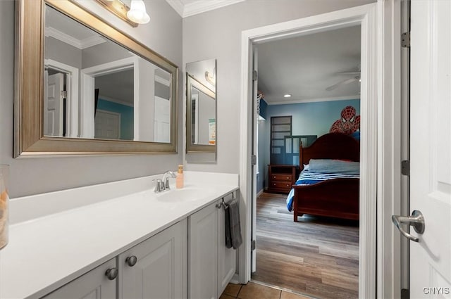 8278 Luchsinger Ln, Lysander, NY 13027 - bathroom featuring crown molding, vanity, a ceiling fan, and tile patterned floors