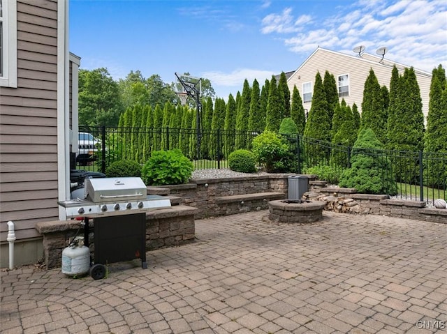 8278 Luchsinger Ln, Lysander, NY 13027 - view of patio featuring an outdoor fire pit and area for grilling