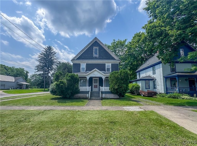 22 Frank St, Cortland, NY 13045 - american foursquare style home with a porch and a front lawn