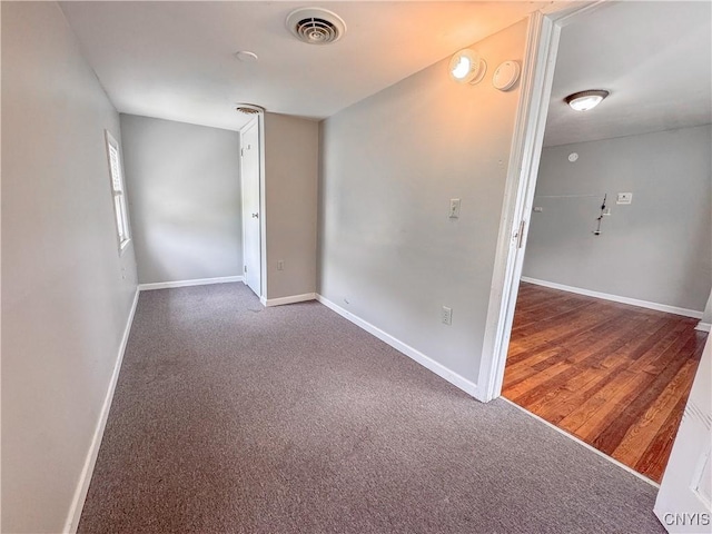 19 Water St, Cortland, NY 13045 - carpeted spare room featuring baseboards