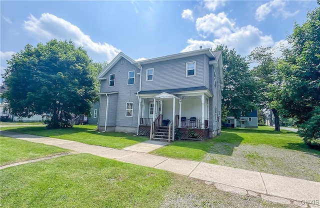 19 Water St, Cortland, NY 13045 - view of front facade featuring covered porch and a front lawn