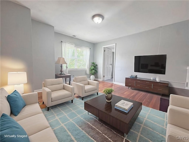 19 Water St, Cortland, NY 13045 - living area featuring wood finished floors and baseboards