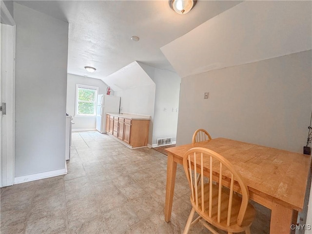 19 Water St, Cortland, NY 13045 - dining area featuring vaulted ceiling and baseboards