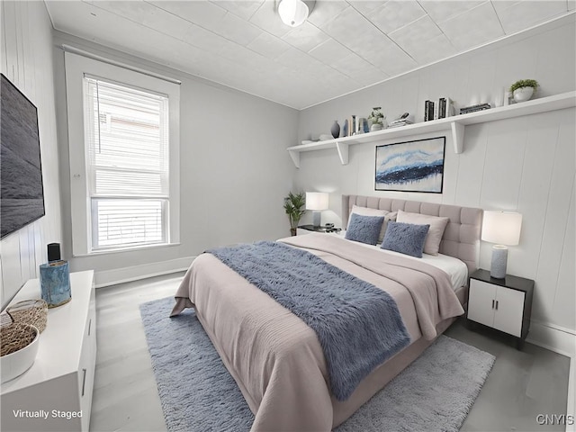 72 Groton Ave, Cortland, NY 13045 - bedroom with multiple windows and wood finished floors