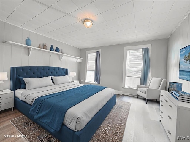 72 Groton Ave, Cortland, NY 13045 - bedroom with wood finished floors and wood walls