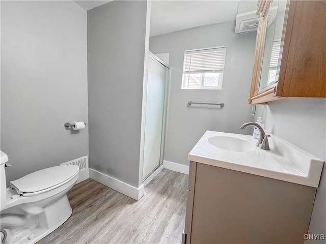 72 Groton Ave, Cortland, NY 13045 - bathroom featuring a shower stall, vanity, and wood finished floors