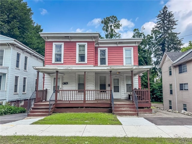 72 Groton Ave, Cortland, NY 13045 - italianate home featuring covered porch