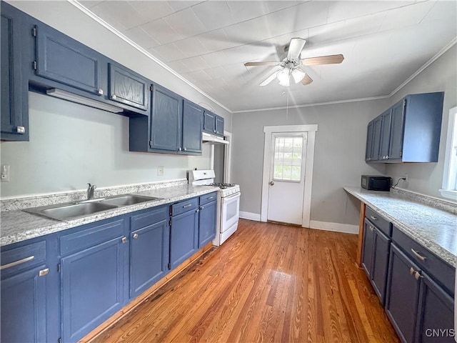 72 Groton Ave, Cortland, NY 13045 - kitchen featuring white range with gas stovetop, blue cabinetry, a ceiling fan, ornamental molding, and under cabinet range hood