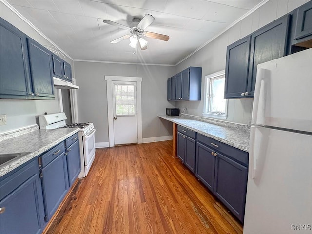 72 Groton Ave, Cortland, NY 13045 - kitchen featuring white appliances, blue cabinets, ceiling fan, under cabinet range hood, and plenty of natural light