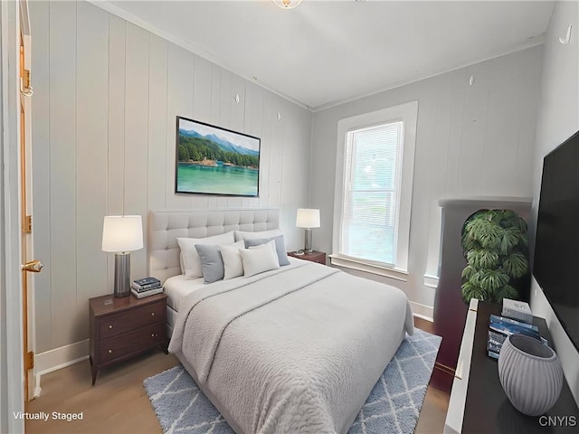 72 Groton Ave, Cortland, NY 13045 - bedroom featuring light wood finished floors and crown molding