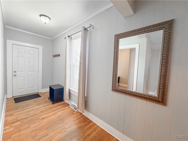 72 Groton Ave, Cortland, NY 13045 - entryway with crown molding, wood finished floors, and plenty of natural light