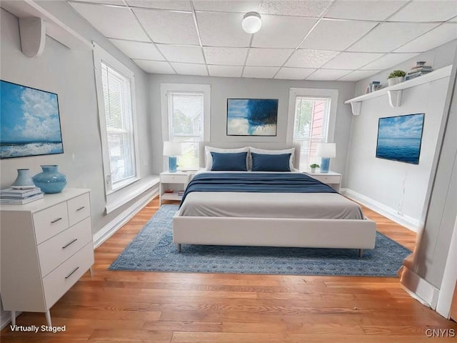 72 Groton Ave, Cortland, NY 13045 - bedroom with a paneled ceiling and light wood-style floors
