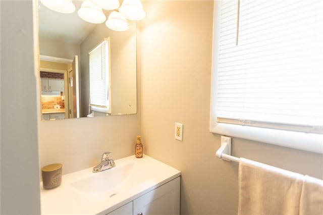 1100 Hatch Rd, Webster, NY 14580 - bathroom with vanity and a chandelier