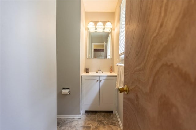 1100 Hatch Rd, Webster, NY 14580 - bathroom featuring vanity, stone finish floors, and a chandelier