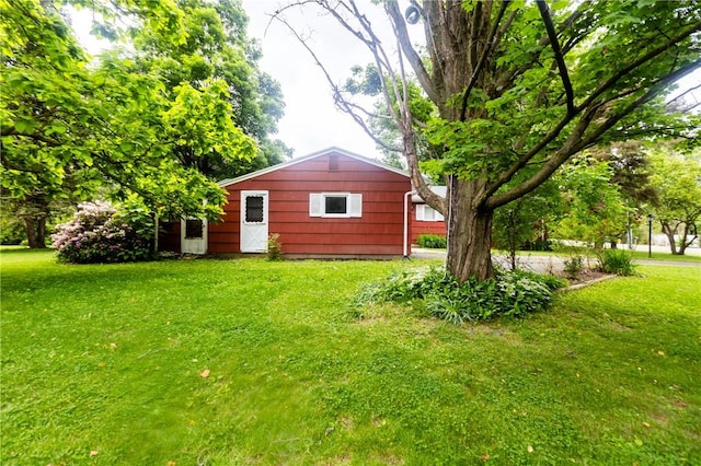 1100 Hatch Rd, Webster, NY 14580 - back of house featuring a lawn and an outdoor structure