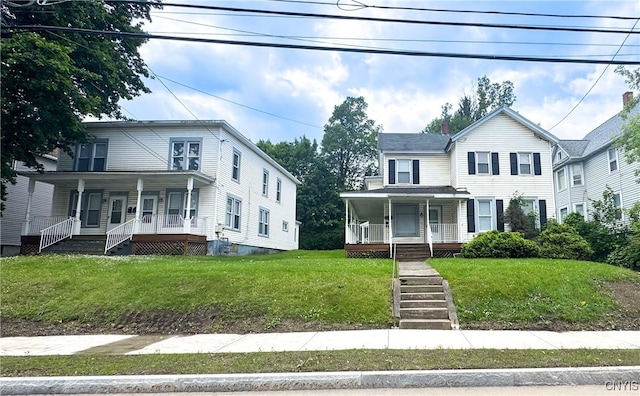 73 Groton Ave Unit 69-71, Cortland, NY 13045 - view of front of property with a porch, a front yard, stairway, and a chimney