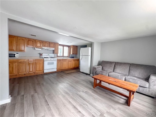 73 Groton Ave Unit 69-71, Cortland, NY 13045 - living area with wood finished floors