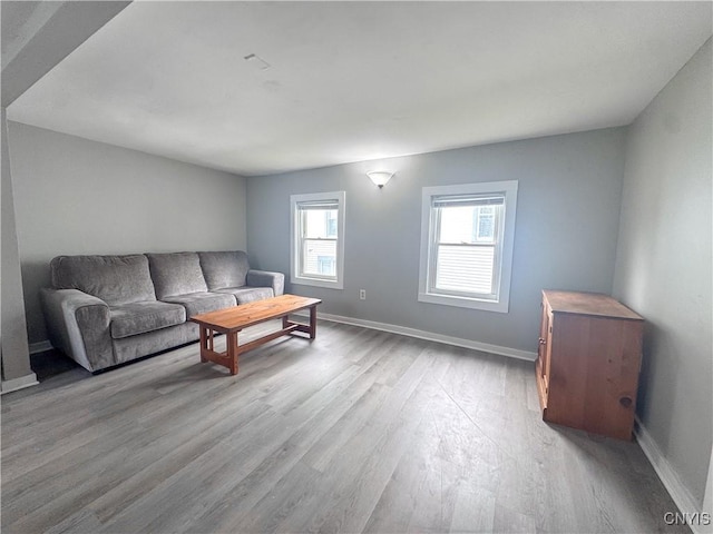 73 Groton Ave Unit 69-71, Cortland, NY 13045 - living area with wood finished floors and baseboards