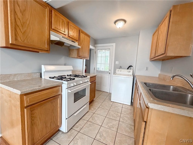 73 Groton Ave Unit 69-71, Cortland, NY 13045 - kitchen featuring under cabinet range hood, white range with gas cooktop, washer / dryer, light tile patterned floors, and light countertops