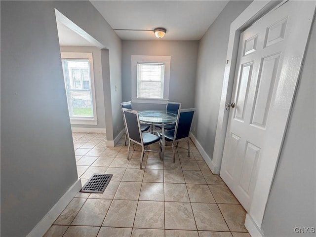 73 Groton Ave Unit 69-71, Cortland, NY 13045 - dining space featuring light tile patterned floors and baseboards