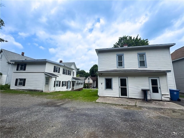 73 Groton Ave Unit 69-71, Cortland, NY 13045 - view of front of house with a chimney
