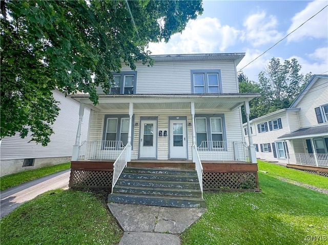 73 Groton Ave Unit 69-71, Cortland, NY 13045 - view of front of property with covered porch and a front lawn