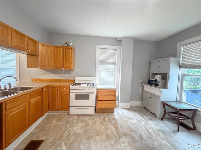73 Groton Ave Unit 69-71, Cortland, NY 13045 - kitchen with white gas range oven and light countertops