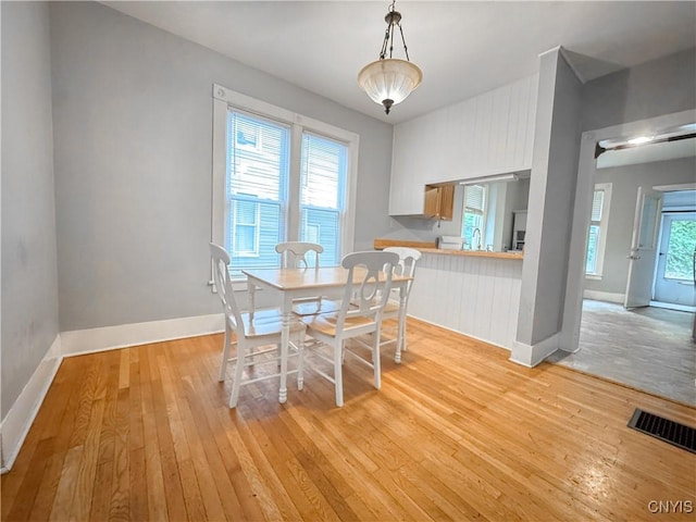 73 Groton Ave Unit 69-71, Cortland, NY 13045 - dining area featuring light wood-style floors and baseboards
