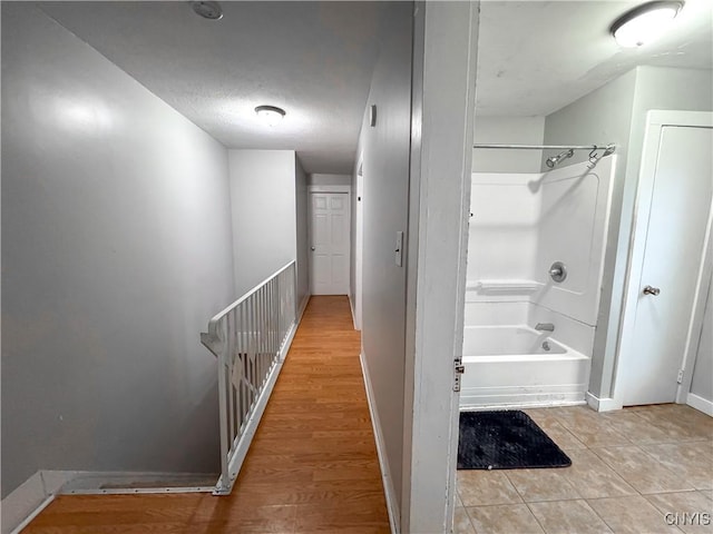 73 Groton Ave Unit 69-71, Cortland, NY 13045 - bathroom featuring shower / washtub combination, a textured ceiling, and tile patterned floors