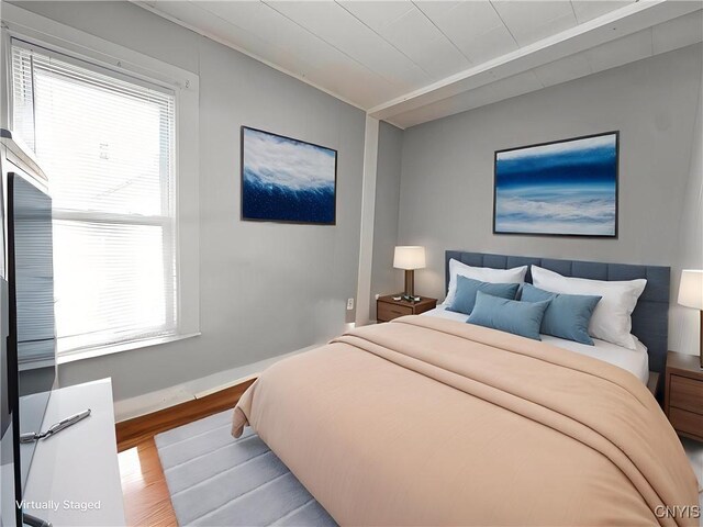 73 Groton Ave Unit 69-71, Cortland, NY 13045 - bedroom featuring wood finished floors and multiple windows