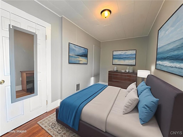 73 Groton Ave Unit 69-71, Cortland, NY 13045 - bedroom featuring wood finished floors and crown molding
