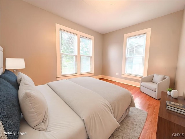 73 Groton Ave Unit 69-71, Cortland, NY 13045 - bedroom with light wood-style flooring and baseboards